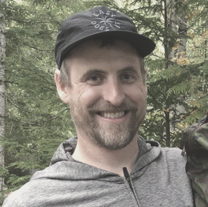 Derek Sullivan smiling outdoors